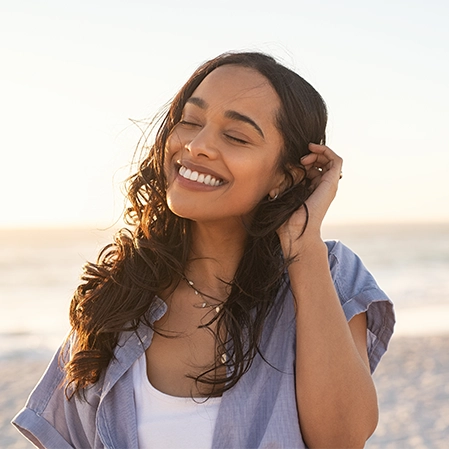 Dentist Raleigh NC Lady Smiling On Beach