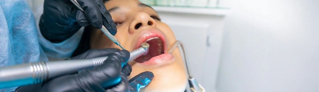 Dentist Raleigh NC Woman Receiving Dental Treatment Dentist Raleigh NC Woman Receiving Dental Treatment